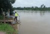 Antisipasi Banjir, Polsek Madang Suku I Pantau Debit Air Sungai Komering