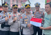 Sambut HUT RI ke-80, Polres OKU Selatan Bagikan Ribuan Bendera 